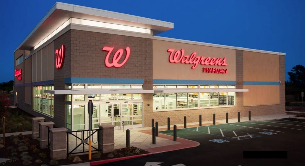 Exterior view of a Walgreens pharmacy at dusk, featuring illuminated signage and a clear entrance, highlighted in the market brief.